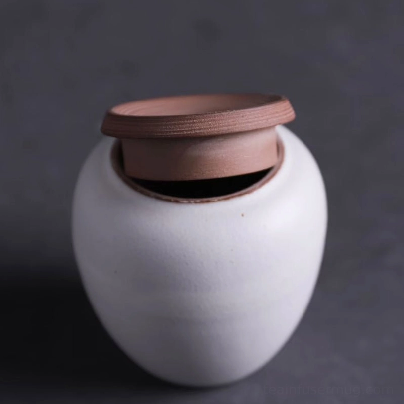 top view of wooden lid on white tea canister