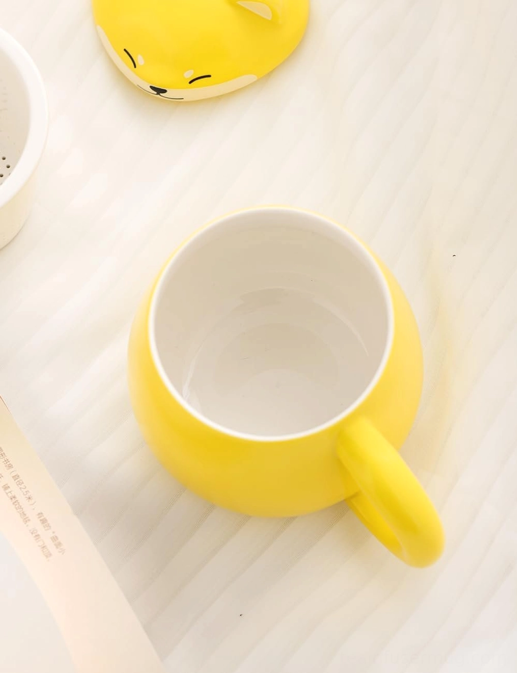 Yellow Shiba Inu tea infuser mug with removable ceramic infuser displayed
