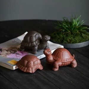 full view of black Yixing purple clay 2-in-1 turtle tea strainer and tea pet